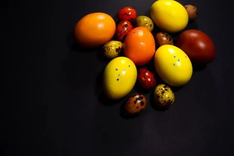 Easter eggs on black background. Copy space Stock Photos