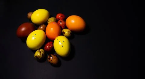 Easter eggs on black background. Copy space Stock Photos