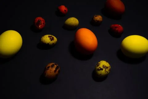 Easter eggs on black background. Copy space Stock Photos