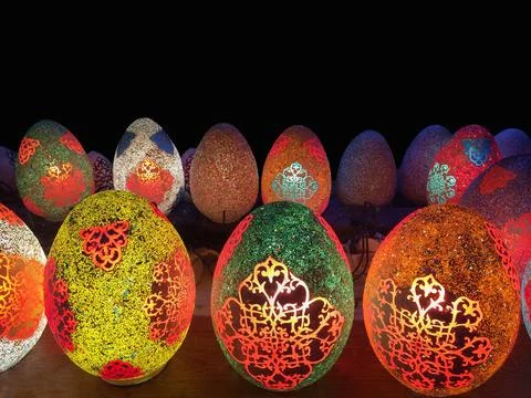 Easter eggs on a black background, side view, the design is made in oriental Stock Photos