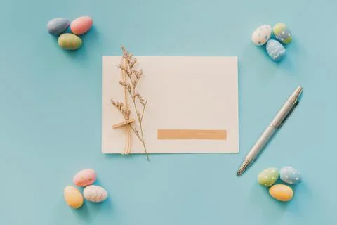 Easter eggs on blue background and greeting card with copy space for text Stock Photos