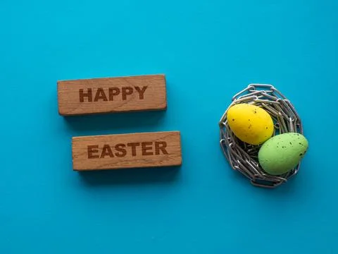 Easter eggs on blue background with metal chain Stock Photos