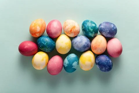 Easter eggs on blue background, top view Фото