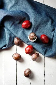 Easter eggs on blue textile draped background Stock Photos