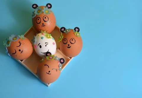 Easter eggs in a box on a blue background. Easter. Stock Photos