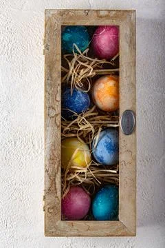 Easter eggs in box with straw. 스톡 사진
