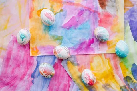 Easter eggs on a bright multicolored background Stock Photos