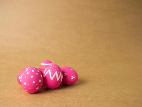 Easter eggs on the brown background. Stock Photos
