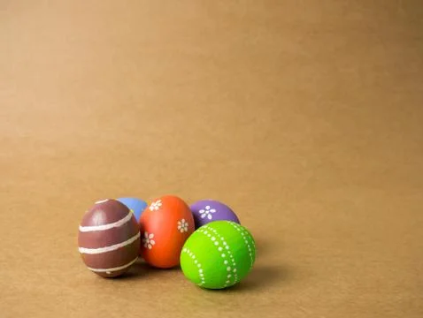 Easter eggs on the brown background. Stock Photos
