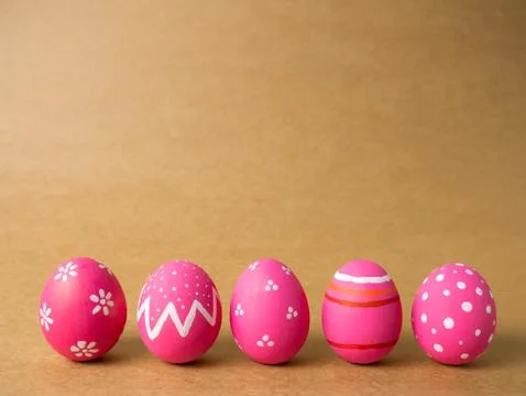 Easter eggs on the brown background. Stock Photos