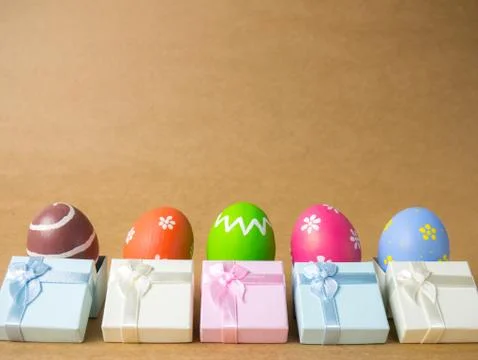 Easter eggs on the brown background. Stock Photos