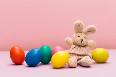 Easter eggs with bunny on colour background Stock Photos