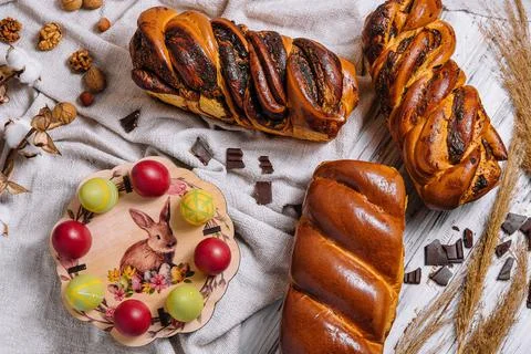 Easter eggs with buns on top view Stock Photos