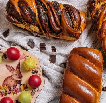 Easter eggs with buns on top view Stock Photos