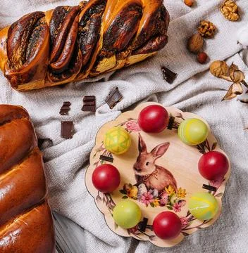 Easter eggs with buns on top view Stock Photos