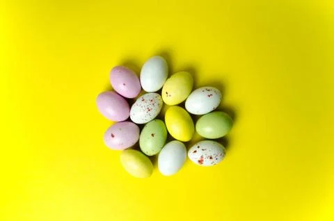 Easter eggs candy at yellow Stock Photos