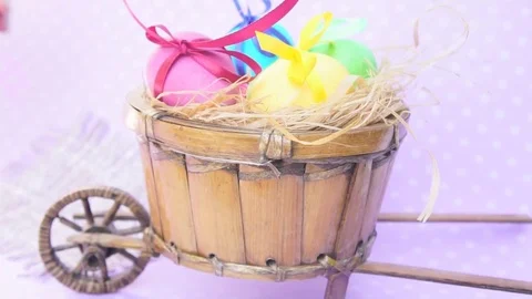 Easter Eggs in a Cart, Behind Put Orange Heart Stock Footage 73613819