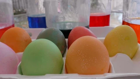 Easter Eggs in Carton with Dye in Background Stock Footage 111584627