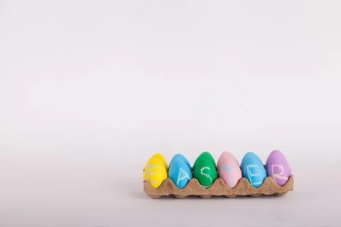 Easter eggs in carton with Easter written on eggs in chalk Stock Photos