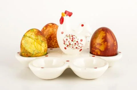 Easter eggs case and three painter traditional eggs low angle Stock Photos