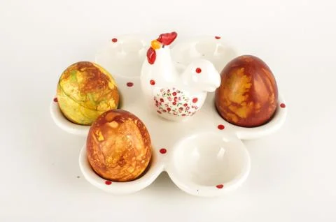 Easter eggs case with three painter traditional eggs on the bright background Stock Photos