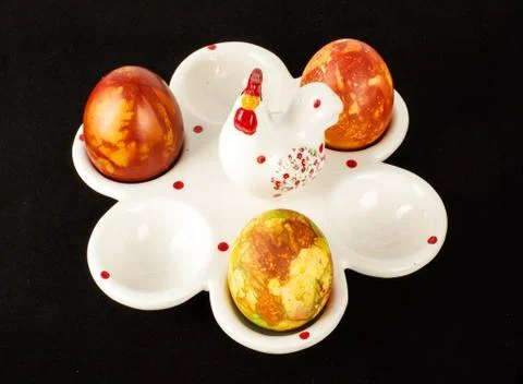 Easter eggs case with three painter traditional eggs top view Stock Photos