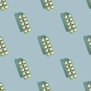 Easter eggs. Chicken white eggs on green background. Stock Photos