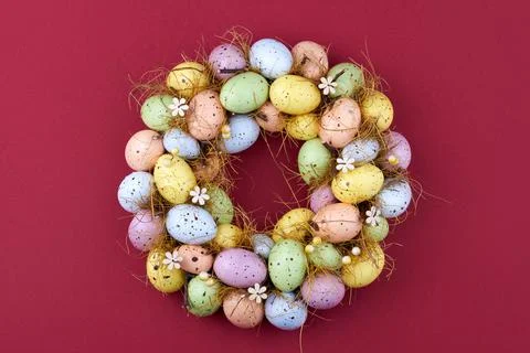 Easter eggs circle on dark red background. Stock Photos