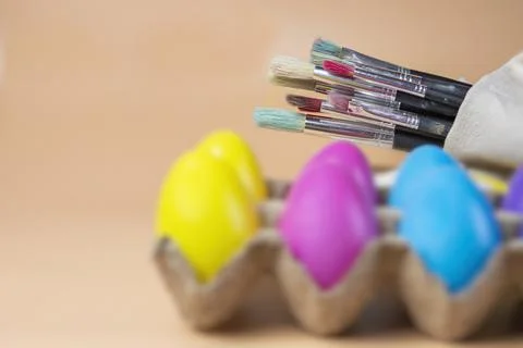 Easter eggs close up and Paint brushes Stock Photos