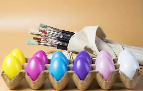 Easter eggs close up and Paint brushes Stock Photos