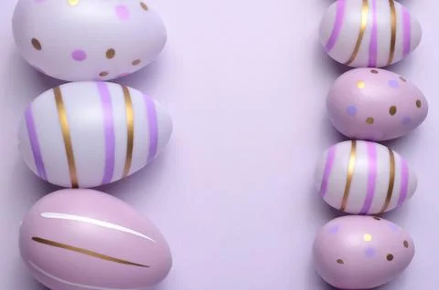 Easter eggs closeup on a purple background. Easter. Stock Photos