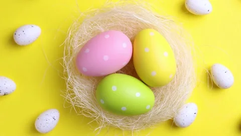 Easter eggs on a colored background, festive background Stock Footage 237480082