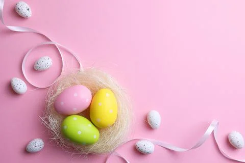 Easter eggs on a colored background, festive background Stock Photos