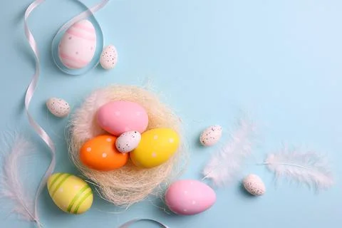 Easter eggs on a colored background, festive background Stock Photos