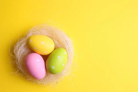 Easter eggs on a colored background, festive background Stock Photos