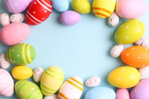 Easter eggs on a colored background, festive background Stock Photos