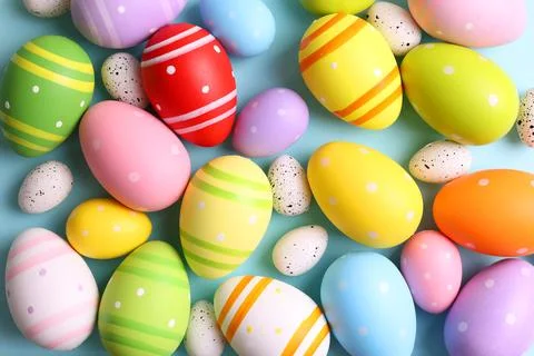 Easter eggs on a colored background, festive background Stock Photos
