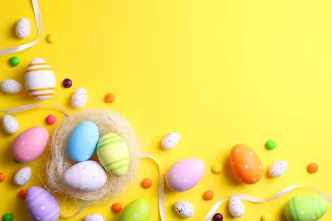 Easter eggs on a colored background, festive background Stock Photos