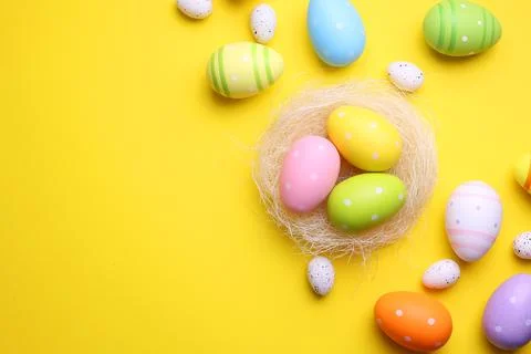 Easter eggs on a colored background, festive background Stock Photos