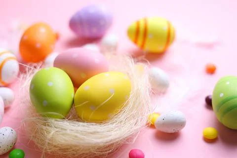 Easter eggs on a colored background, festive background Stock Photos