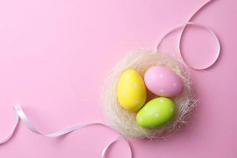 Easter eggs on a colored background, festive background Stock Photos