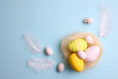 Easter eggs on a colored background, festive background Stock Photos