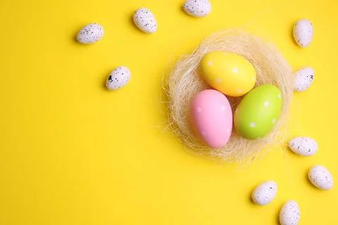 Easter eggs on a colored background, festive background Stock Photos