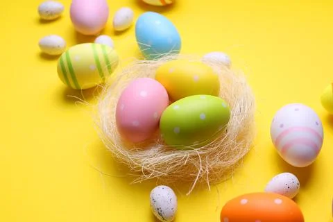 Easter eggs on a colored background, festive background Stock Photos