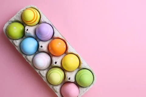 Easter eggs on a colored background, festive background Stock Photos