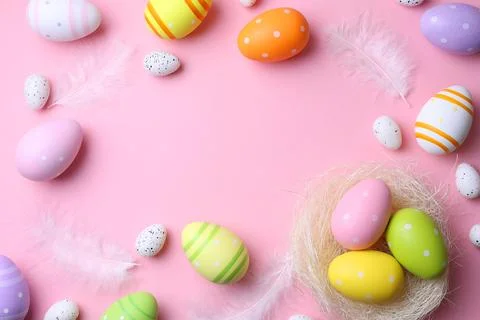 Easter eggs on a colored background, festive background Stock Photos