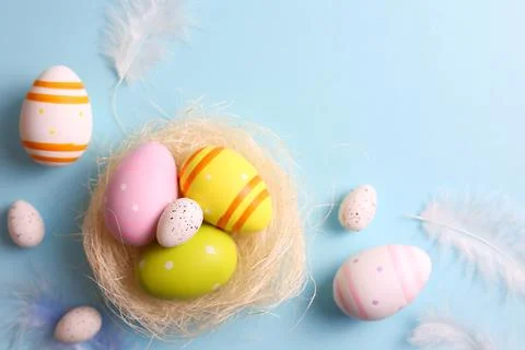 Easter eggs on a colored background, festive background Stock Photos