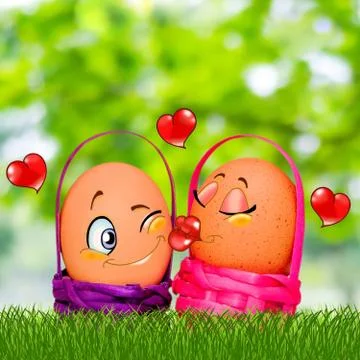 Easter eggs in colored baskets on grass and on a blurry background Stock Photos