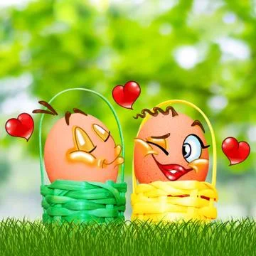 Easter eggs in colored baskets on grass and on a blurry background Foto stock