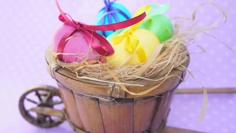 Easter eggs colored in a decorative cart Stock Footage 73613407